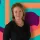 Pamela Baxter, professionally dressed, posing for a formal portrait. She is the Managing Director for IELTS at Cambridge University Press & Assessment